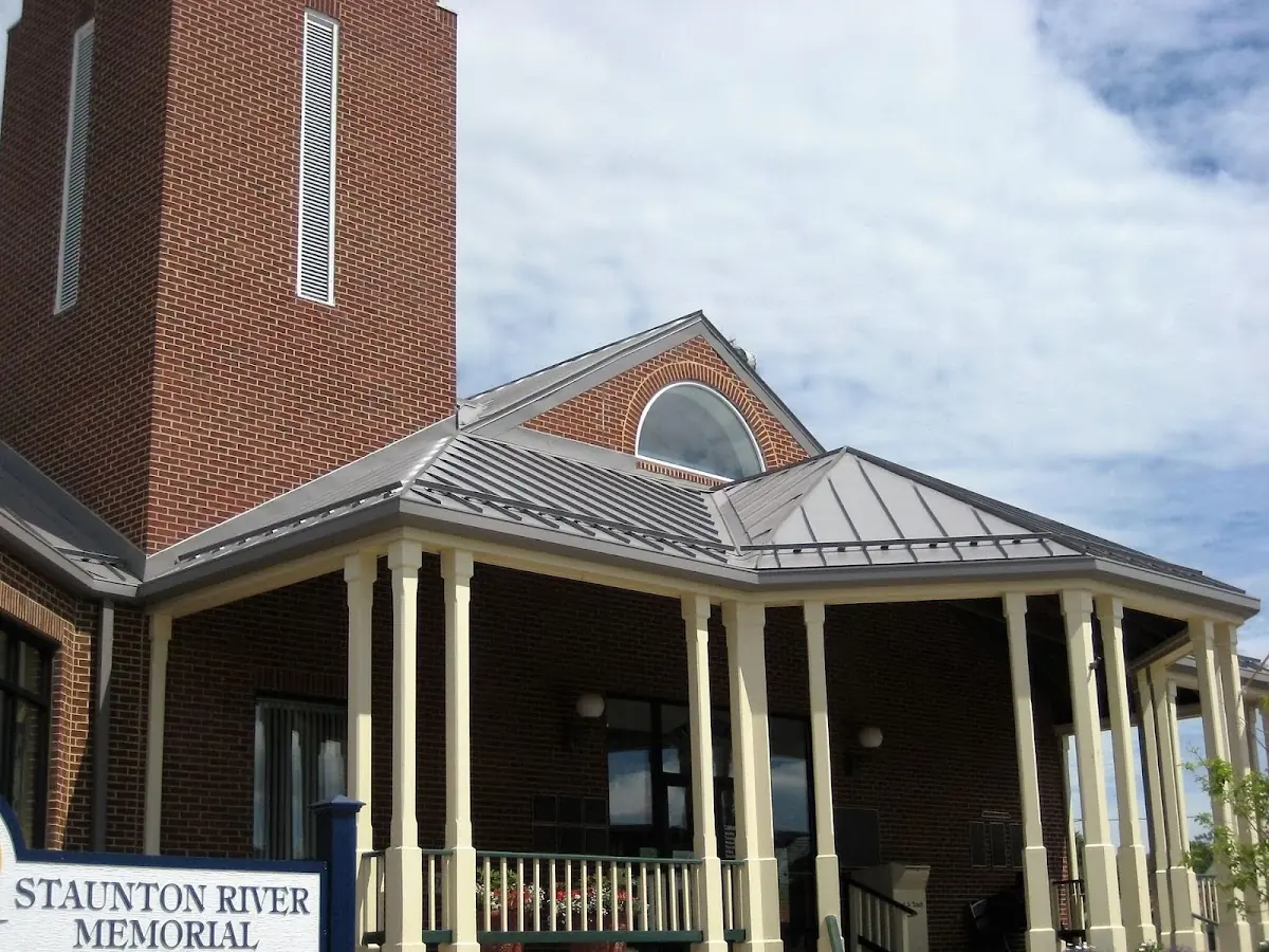 Skilled roofing craftsmen working on a residential roof in Bellmawr